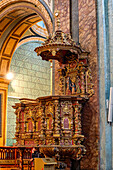 An ornate pulpit in the El Sagrario Church, part of the Metropolitan Cathedral complex, in Quito, Ecuador.