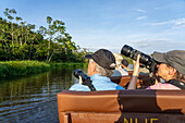 A wildlife photography tour in a canoe in the Napo Wildlife Center in Yasuni National Park, Ecuador.