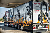 A customized truck featuring Johnny Cash imagery and references parked at a gas station in Marchena, Seville, Andalusia, Spain.