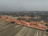 Aerial view of industrial brick fields and factories with smokestacks, Baktaballi, Narayanganj, Bangladesh.