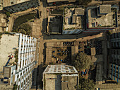 Aerial view of urban residential buildings and rooftops in a densely populated neighborhood, Mohammadpur Upazila, Dhaka, Bangladesh.