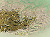 Aerial view of serene wetlands and marshland with natural patterns and aqua tones, Bahia de Cadiz, Cadiz, Spain.