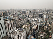 Aerial view of a bustling cityscape with modern skyscrapers and dense urban infrastructure, Paltan Thana, Dhaka, Bangladesh.