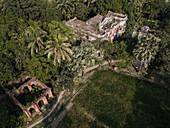 Aerial view of a beautiful heritage mansion surrounded by lush greenery and palm trees, Narshingdi, Dhaka, Bangladesh.