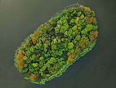 Aerial view of mirpur lake surrounded by lush green land and tranquil water, Dhaka, Bangladesh.