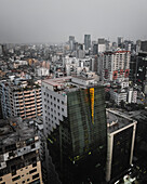 Aerial view of bustling cityscape with modern skyscrapers and dense urban infrastructure, Shahbag, Dhaka, Bangladesh.