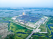 Aerial view of sewage treatment plant and urban infrastructure in Dasherkandi, Dhaka, Bangladesh.