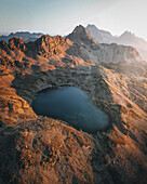 Aerial view of serene alpine landscape with majestic mountains and a tranquil lake, Sils, Kanton Graubunden, Switzerland.