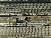 Aerial view of organized brick fields with people working in a factory, Suti Para Union, Dhamrai, Dhaka, Bangladesh.