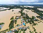 Aerial view of flooded village with submerged homes and waterlogged streets, Mirsarai, Chittagong, Bangladesh.