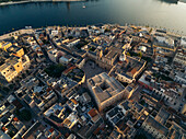 Aerial view of cattedrale di san giovanni battista amidst picturesque old town and coastal scenery, Brindisi, Brindisi, Italy.