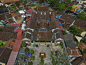 Aerial view of traditional architecture and colorful rooftops in a picturesque old town, Minh An, Quang Nam, Vietnam.