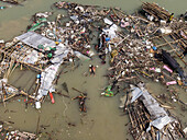 Aerial view of destroyed fishing village with wreckage and debris after cyclone Sitrang, Potenga, Chittagong, Bangladesh.