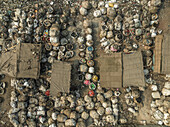 Aerial view of recycling centre with garbage bags and makeshift shelters in a polluted environment, Chowkbazar Thana, Dhaka, Bangladesh.