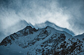 Aerial view of majestic snow-covered peaks and dramatic alpine landscape, Morteratsch, Graubunden, Switzerland.