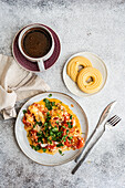 Savoury chicken and egg omelette with tomato and cheese, cooked in olive oil Served with black coffee and biscuits for a balanced, healthy breakfast treat