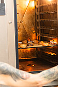 Freshly baked Italian pastries in a warmly lit, rustic oven exude the authentic charm and delicious aroma of a traditional bakery and emphasise the artisan craftsmanship