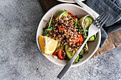 A nutritious and colourful dish made from fresh rocket, oregano, cherry tomatoes, cucumber, Himalayan salt, red onion, buckwheat, lemon and organic olive oil.