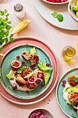 A colourful dish with Mediterranean meatballs on colourful plates, garnished with cucumber, onions, yoghurt and pomegranate. Lemon and herbs add freshness, perfect for food concepts.