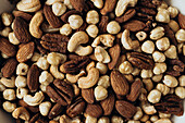 A variety of mixed nuts, including almonds, cashews, pecans and hazelnuts, providing a rich blend of texture and flavour - perfect for snacking, baking or cooking