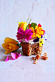 Japanese-inspired carrot cupcake with apple mint and edible flowers.