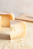 Detail of a piece of Italian cheese called 'Pecorino', front view.