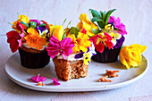 Japanese-inspired carrot cupcakes with apple mint and edible flowers.