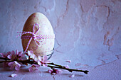 Strawberry and white chocolate Easter egg. Horizontal alignment with negative space.