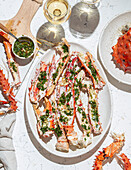 Delicious crab legs, garnished with fresh herbs and garlic, form the centrepiece of this delicious dish. Paired with white wine, this gourmet dish is both visually and flavourfully appealing