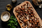 Poplar mushrooms on a wooden table.
