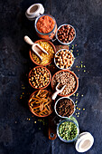 Selection of dried and preserved pulses and pasta made from pulses for plant-based wholefoods.