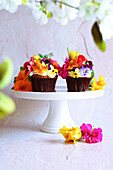 Japanese-inspired carrot cupcakes with apple mint and edible flowers.