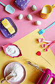 Modern back concept flatlay with retro pink and yellow colour blocking aesthetics.