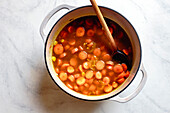 Preparing homemade carrot soup in a pot