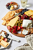 Californian cheese platter with fruit, crackers and olives