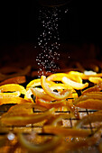 Sugar sprinkling on candied yuzu citrus peel