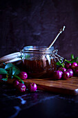 Australian Lilly-Pilly-Riberry jam against a black background.