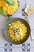 Cauliflower couscous with cod and almonds