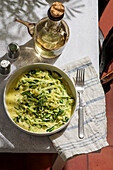 Creamy garlic and courgette noodles (zoodles), served as a healthy, low-carb pasta alternative