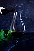 Decanting red wine concept shown with swan style decanter which is suitable for bold wine such as Shiraz Cabernet.