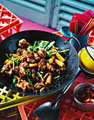 'Drunken' chicken from the wok with baby corn and green chilli
