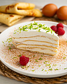 Crêpe cake with lime cream and raspberries