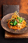 Lentil dal with pointed cabbage tofu and sesame black salsify vegetables