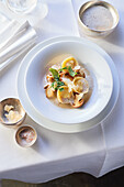 Potato agnolotti with porcini mushrooms and baked herbs
