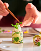 Rice leaf rolls with avocado, feta and quinoa