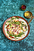 Papdi Chaat (Indian snack) made from crispy puris, yoghurt and chutneys