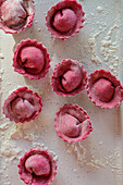 Fresh homemade beetroot ravioli with ricotta filling