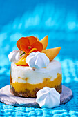 Mango and lemon ice cream tartlets with biscuit base and meringue