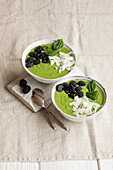 Green smoothie bowl with blackberries