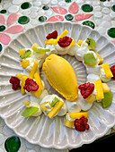 Pavlova crown with mango sorbet